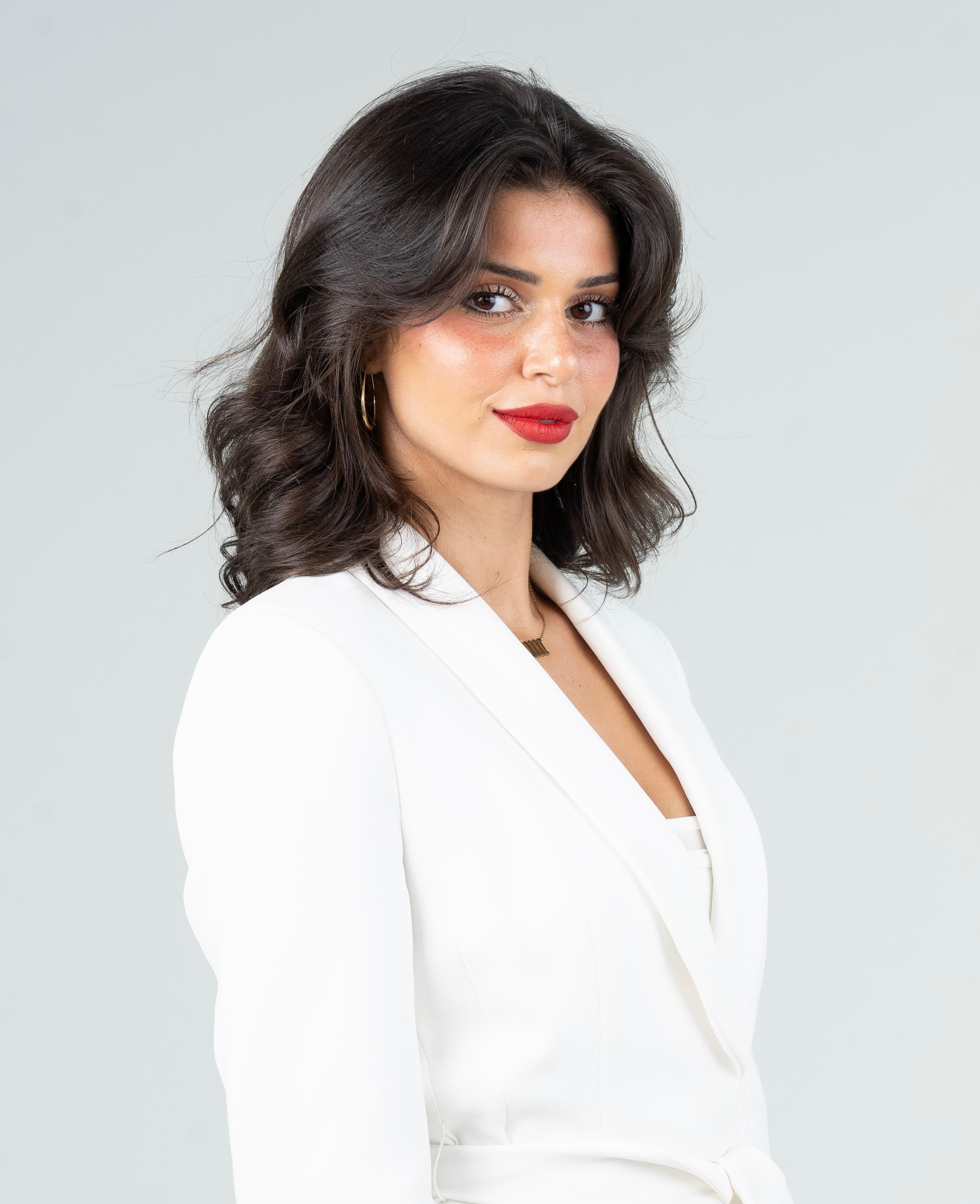 Portrait of Nadia Khaled in a white blazer